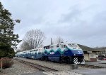 Southbound Sounder Train # 1507, with an F59PHI in the lead, has just departed the Kent Sounder Station and is passing the former Northern Pacific station on the right.